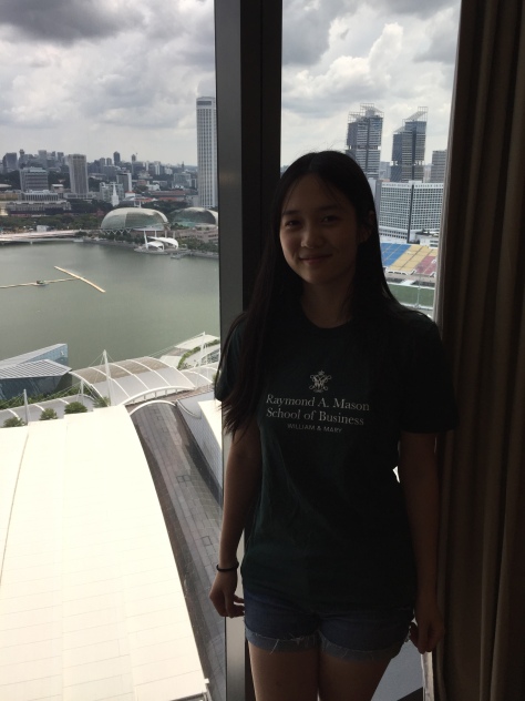 Anne Li enjoys a city view from her luxurious Marina Bay Sands hotel room